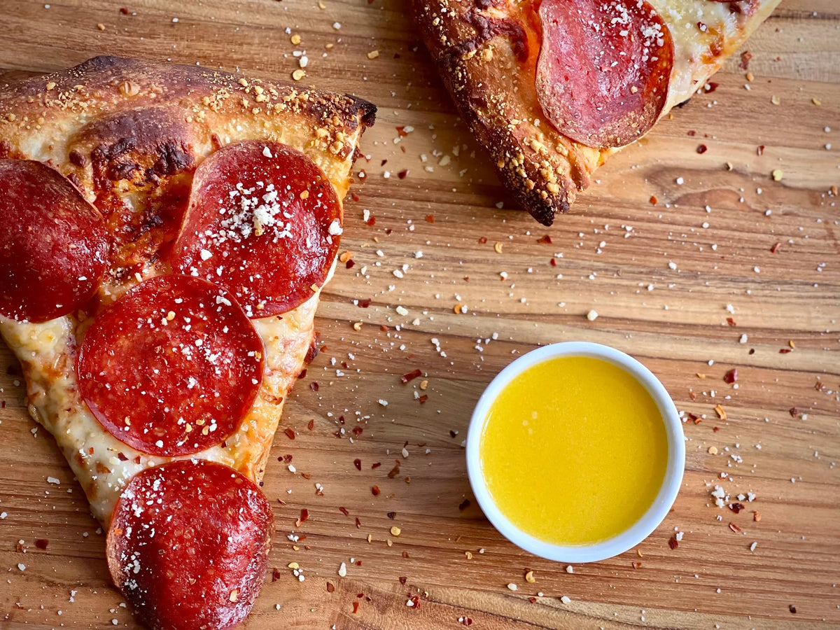 Grandioso garlic sauce cup with breadsticks highlighting creamy Italian flavor