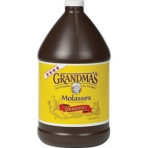Grandma's Original Unsulphured Molasses bottle pour for rich baking glaze and versatile natural sweetener.
