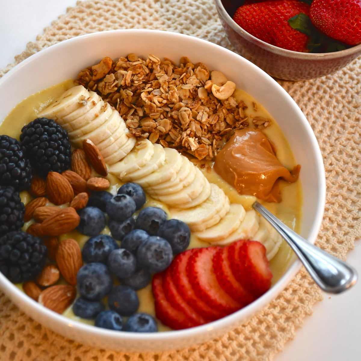 Grandy Organics Classic Granola in a bowl with yogurt and fruit for fiber and protein
