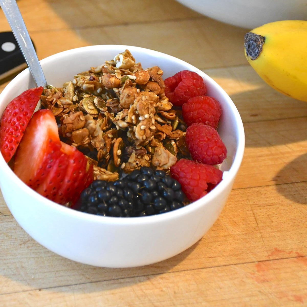 Grandy Organics Coconola close-up reveals crunchy granola clusters and coconut chips