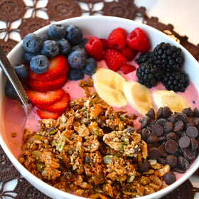 Grandy Organics Coconola ingredients close-up with nuts seeds and fair trade chocolate