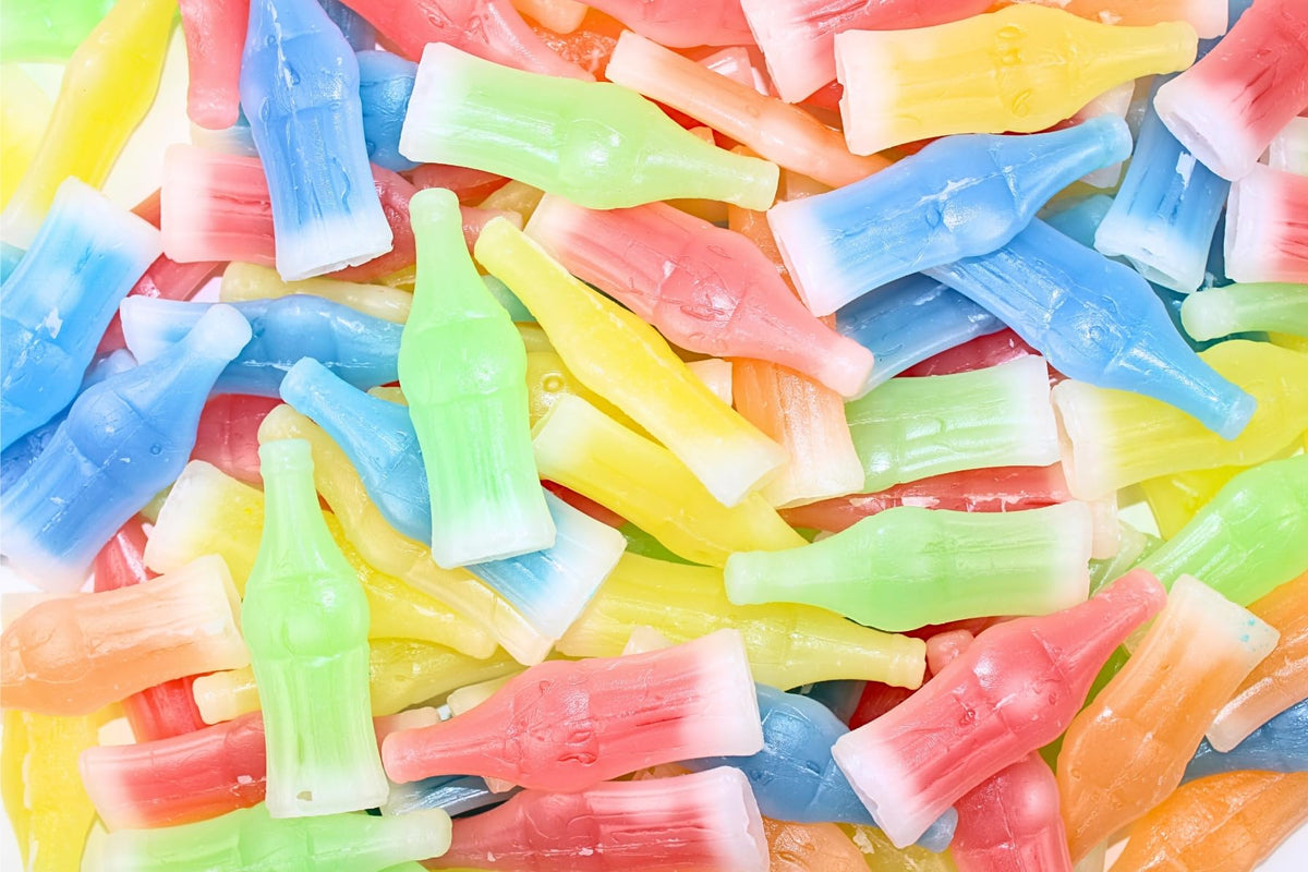 Grandys Candys Nik-L-Nips wax bottles with fruity syrup flavors, ideal for nostalgic celebrations and gifts.