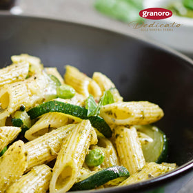 Two 1 lb bags of Granoro Dedicato Penne Rigate displayed on a counter.