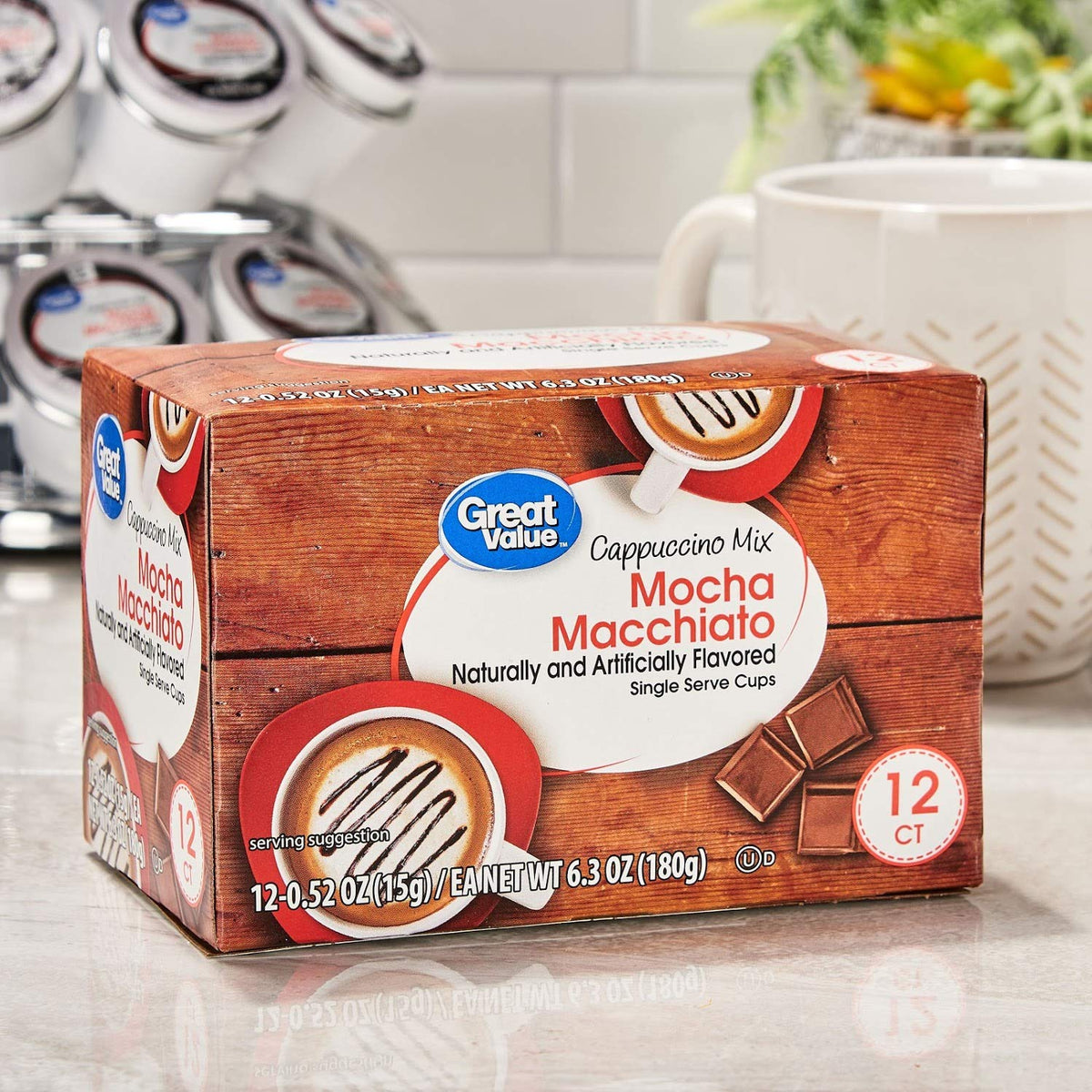 Great Value cappuccino pods showing creamy foam topping for café-style drinks.