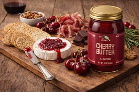 Green Jay Gourmet Cherry Butter on breakfast table, suggesting toast, crumble bars, or cinnamon rolls.