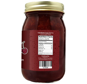 Green Jay Gourmet Cherry Jam jar on counter ready to spread on toast.