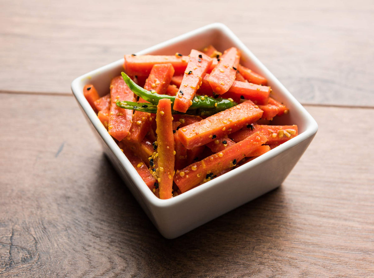 Green Jay Gourmet pickled carrot sticks as a bright salad garnish option.
