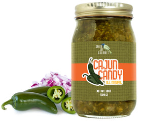Green Jay Gourmet Cajun Candy Relish jar on counter, ideal for burgers and hot dogs.