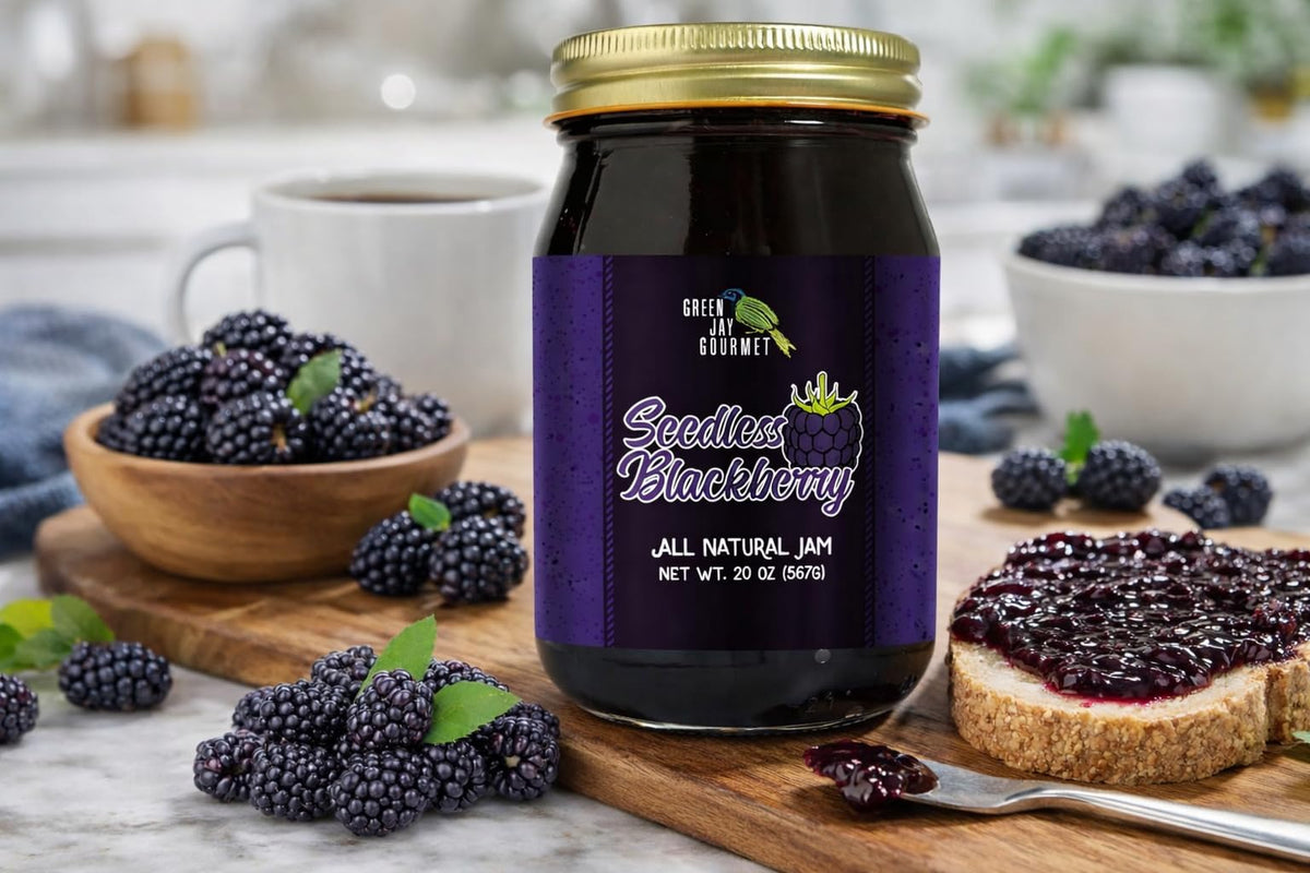 Green Jay Gourmet Seedless Blackberry Jam being poured; versatile jam for pastries.