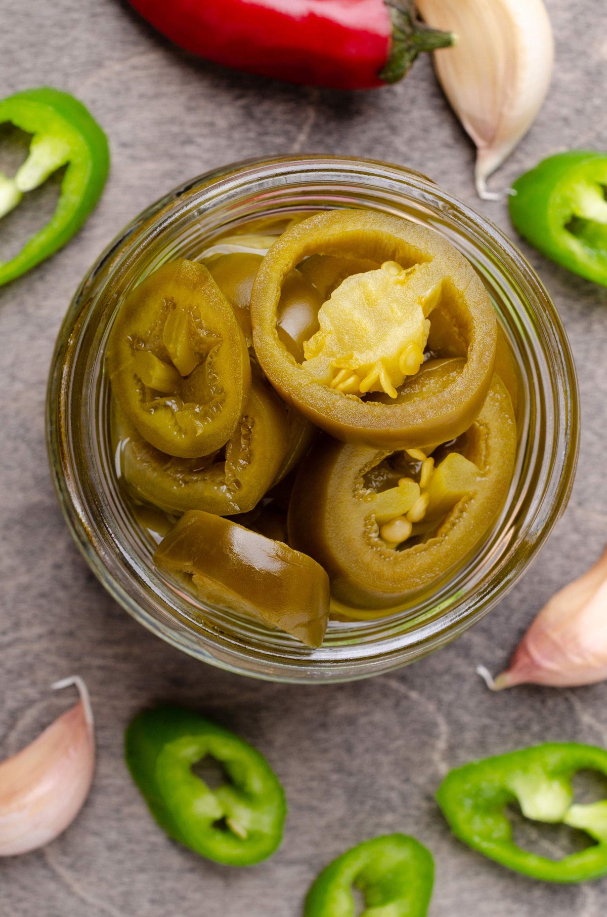 Green Jay Gourmet sliced jalapeños display, ideal for topping burgers and salads