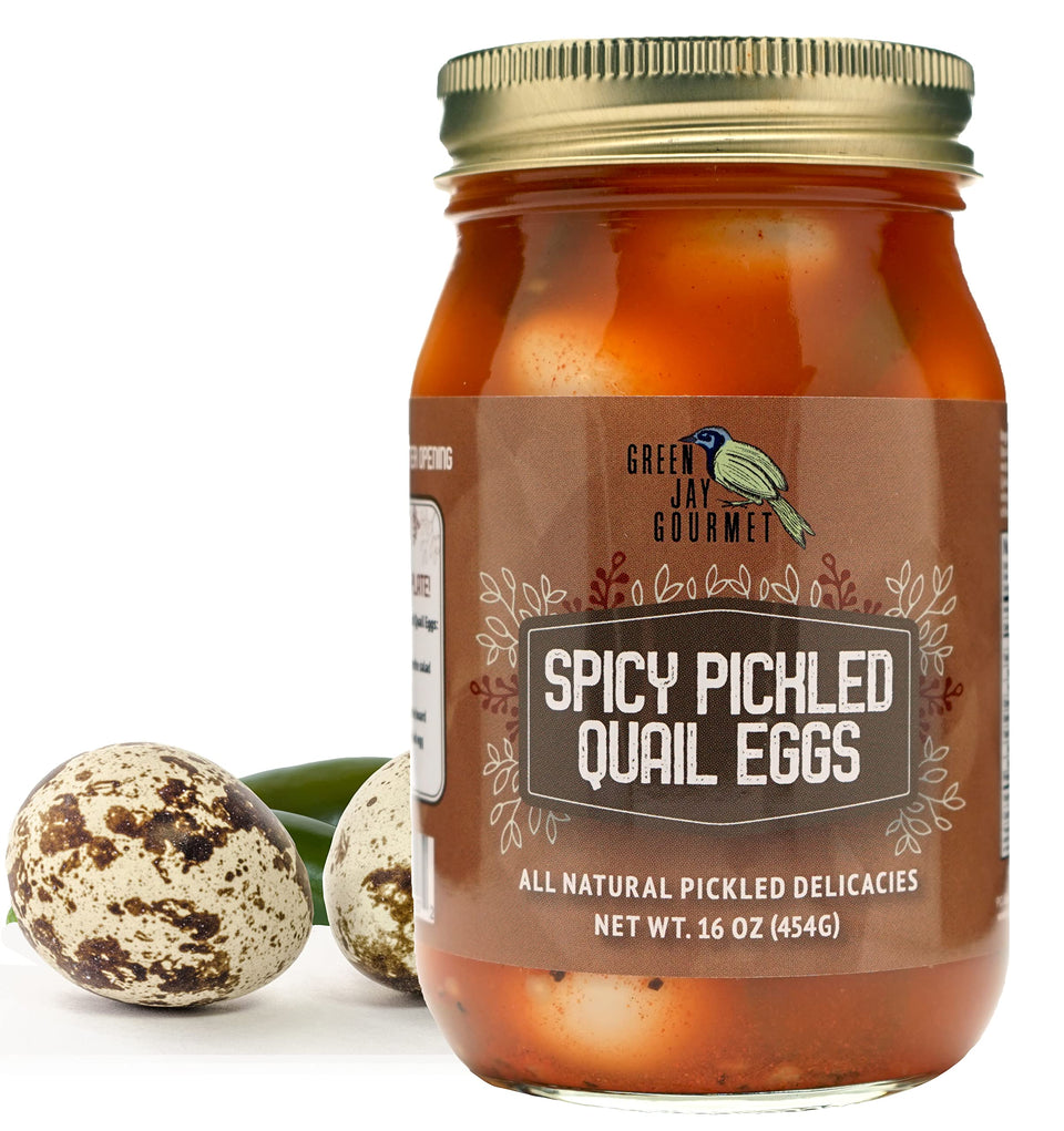 Green Jay Gourmet spicy pickled quail eggs in a jar ready to enjoy.