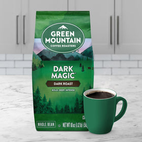 Green Mountain Dark Magic coffee beans in a dark roast closeup.