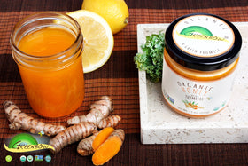 Greenbow honey turmeric swirl-spoon shot beside a snack
