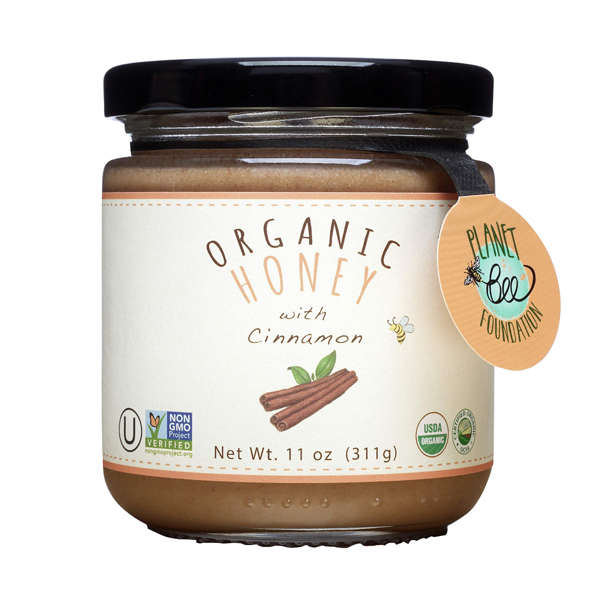 Greenbow Organic Honey with Cinnamon jar ready to drizzle on toast