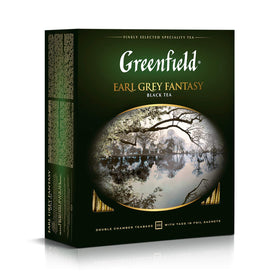 Greenfield Earl Grey Fantasy cup with lemon slice, highlighting citrus notes.