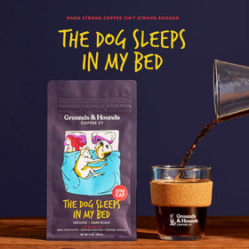 Grounds & Hounds dark roast cup being poured, showcasing bold aroma and strong flavor.