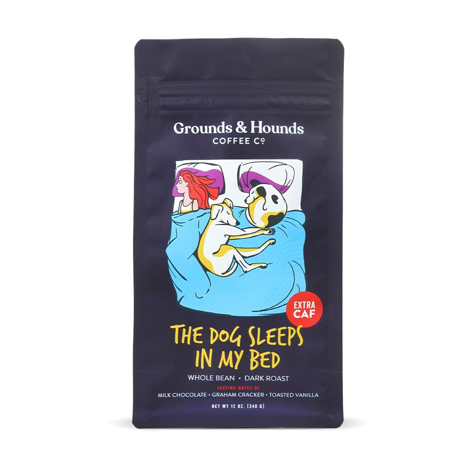 Grounds & Hounds coffee bag on a cozy dog bed, ideal for pet-friendly mornings.