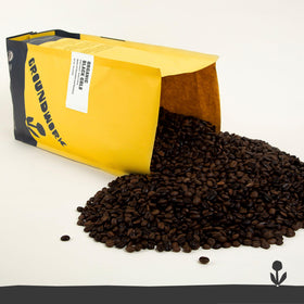 Groundwork Black Gold coffee beans close-up showing glossy roast and aroma.