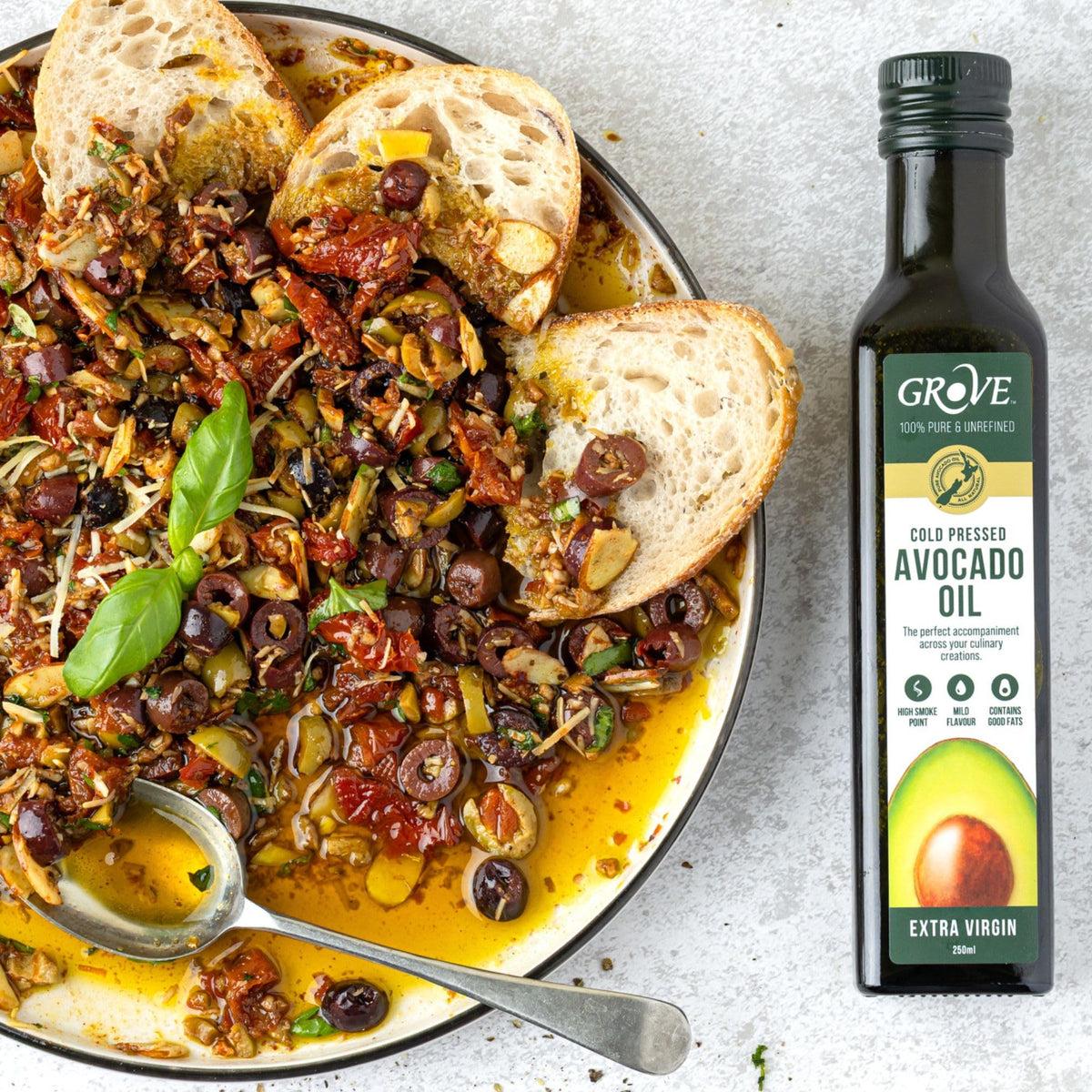 Grove avocado oil in a hot pan for searing.