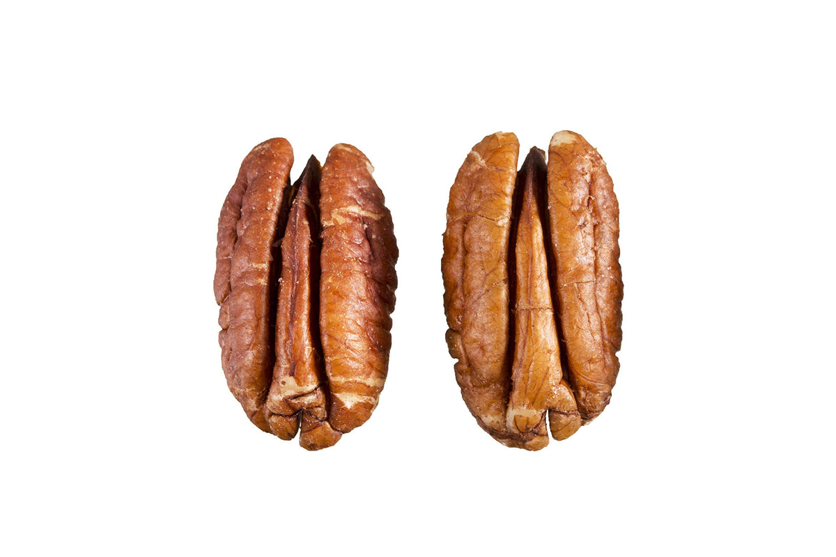 Grupo La Nogalera pecan halves in a mixing bowl for baking.