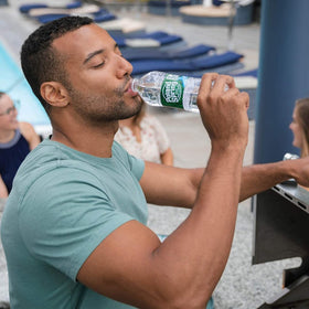 Gym bag ready Gsuila Poland Spring mini water bottles for fast hydration.