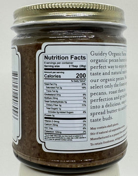 Guidry Organic Farms Pecan Butter with spoon illustrating simple two-ingredient recipe
