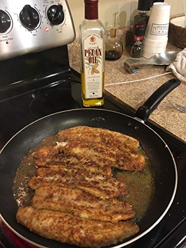 Guidry Organic Farms pecan oil pour ready for sautéing and finishing dishes.