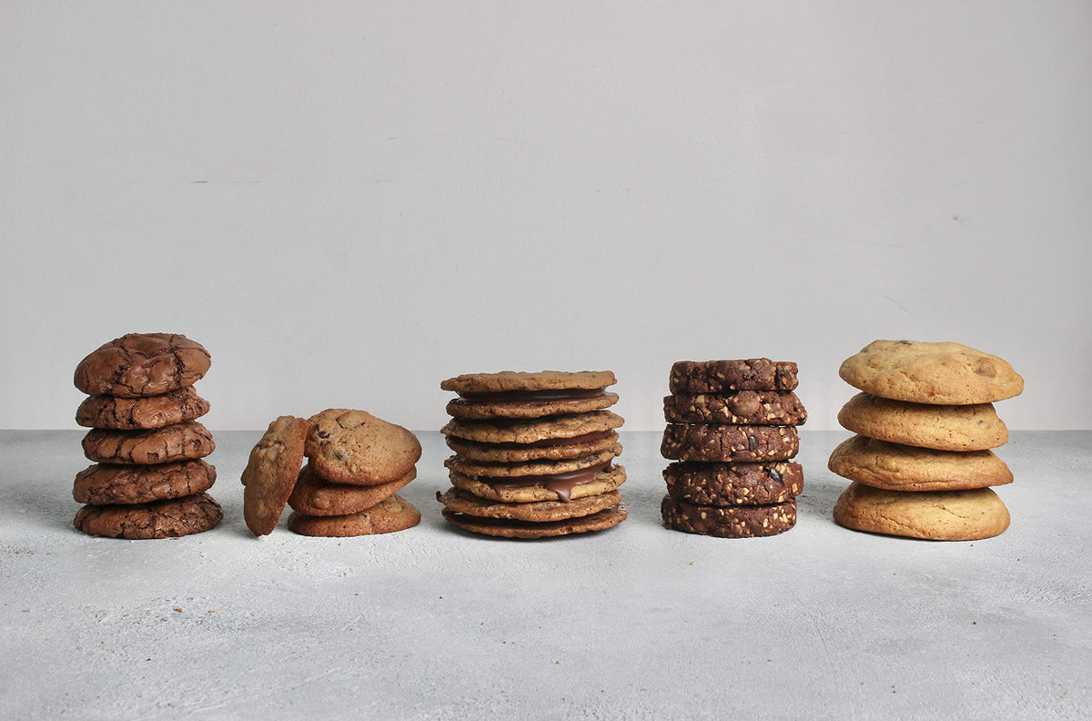 Guittard Milk Chocolate Baking Chips baked cookies on a plate.