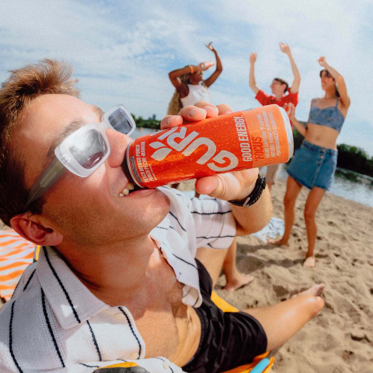 GURU Peach Mango Punch can side view highlighting portability and convenience.