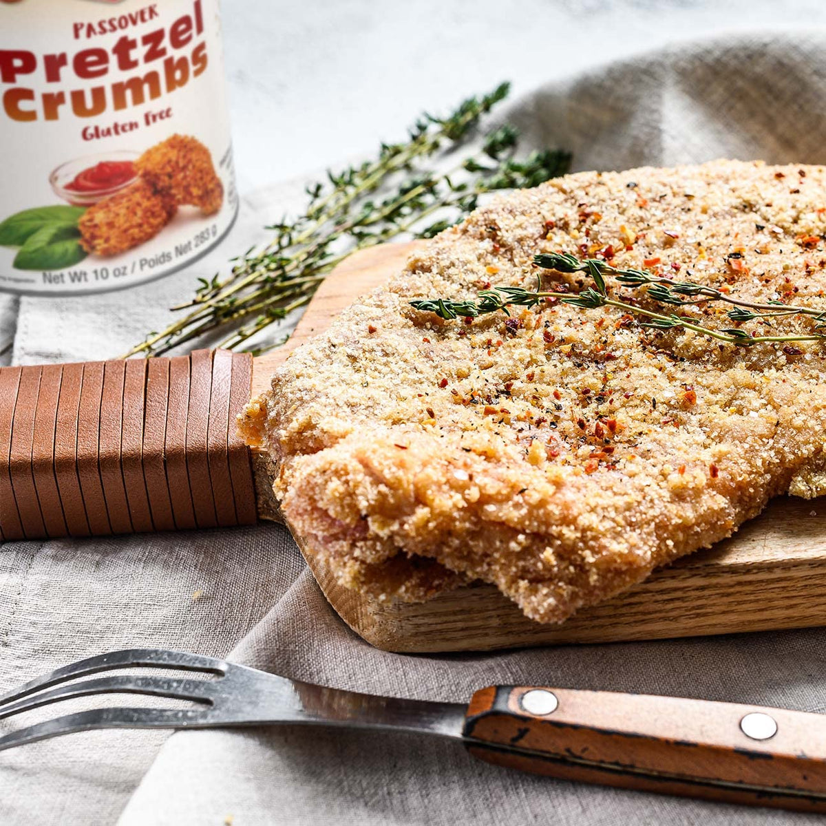 Haddar Pretzel Crumbs coating chicken with a light, flaky crust.