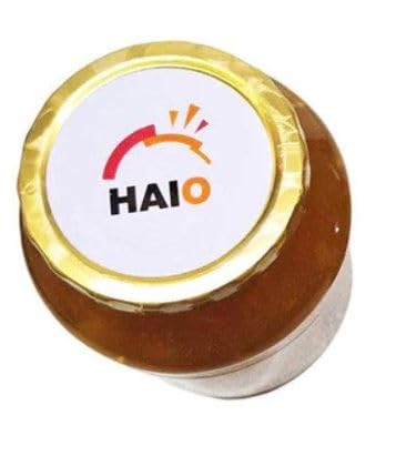 Pouring HAIO ginger tea brew into a cup, showcasing aroma and warmth.