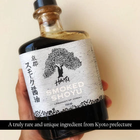 Kitchen scene featuring HAKU Smoked Shoyu, traditional Japanese craftsmanship
