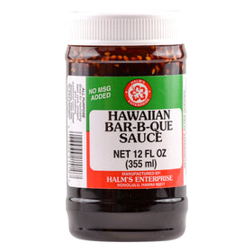Pouring Halm's Hawaiian Barbeque Sauce to glaze grilled meat