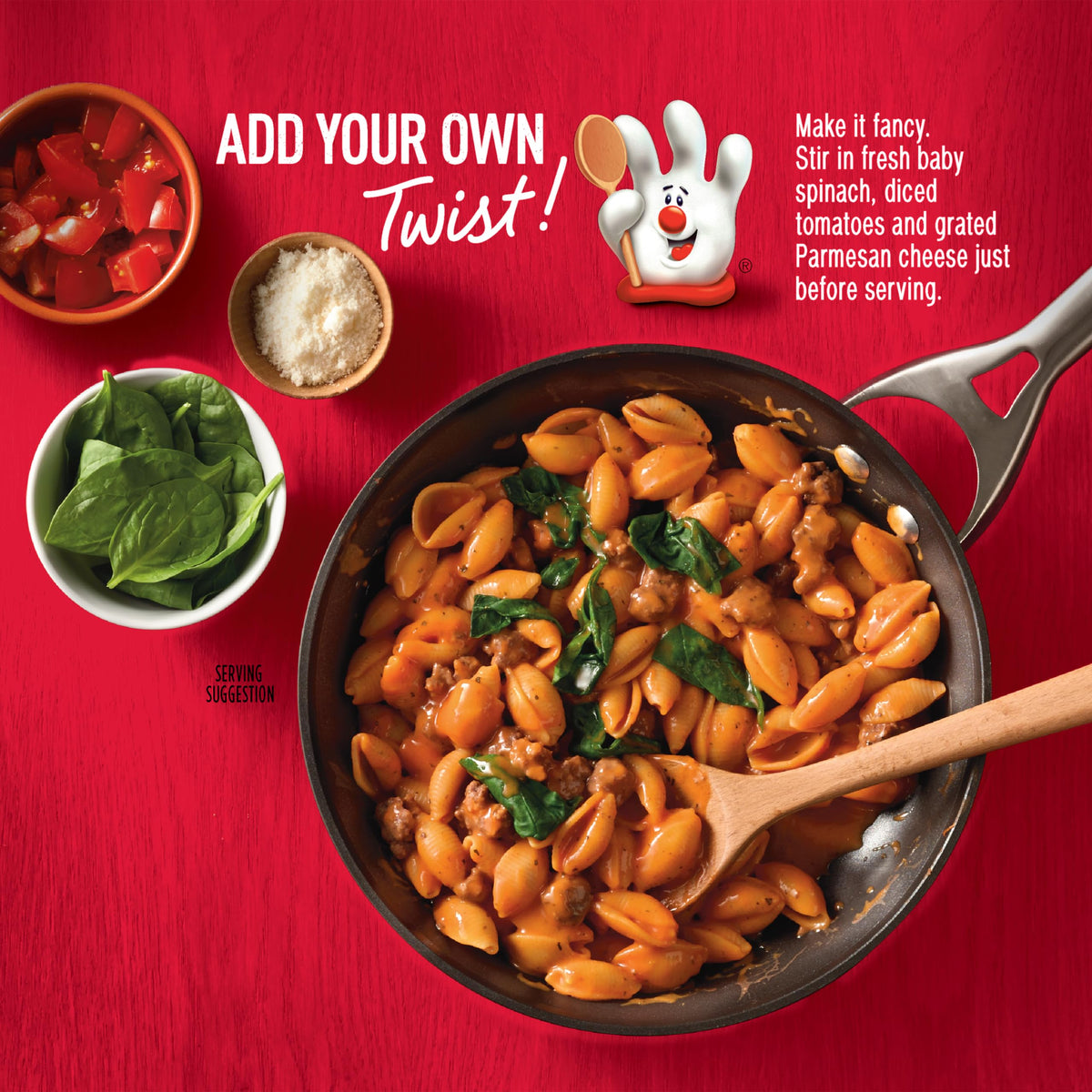 Hamburger Helper Cheesy Italian Shells plated with spinach and parmesan