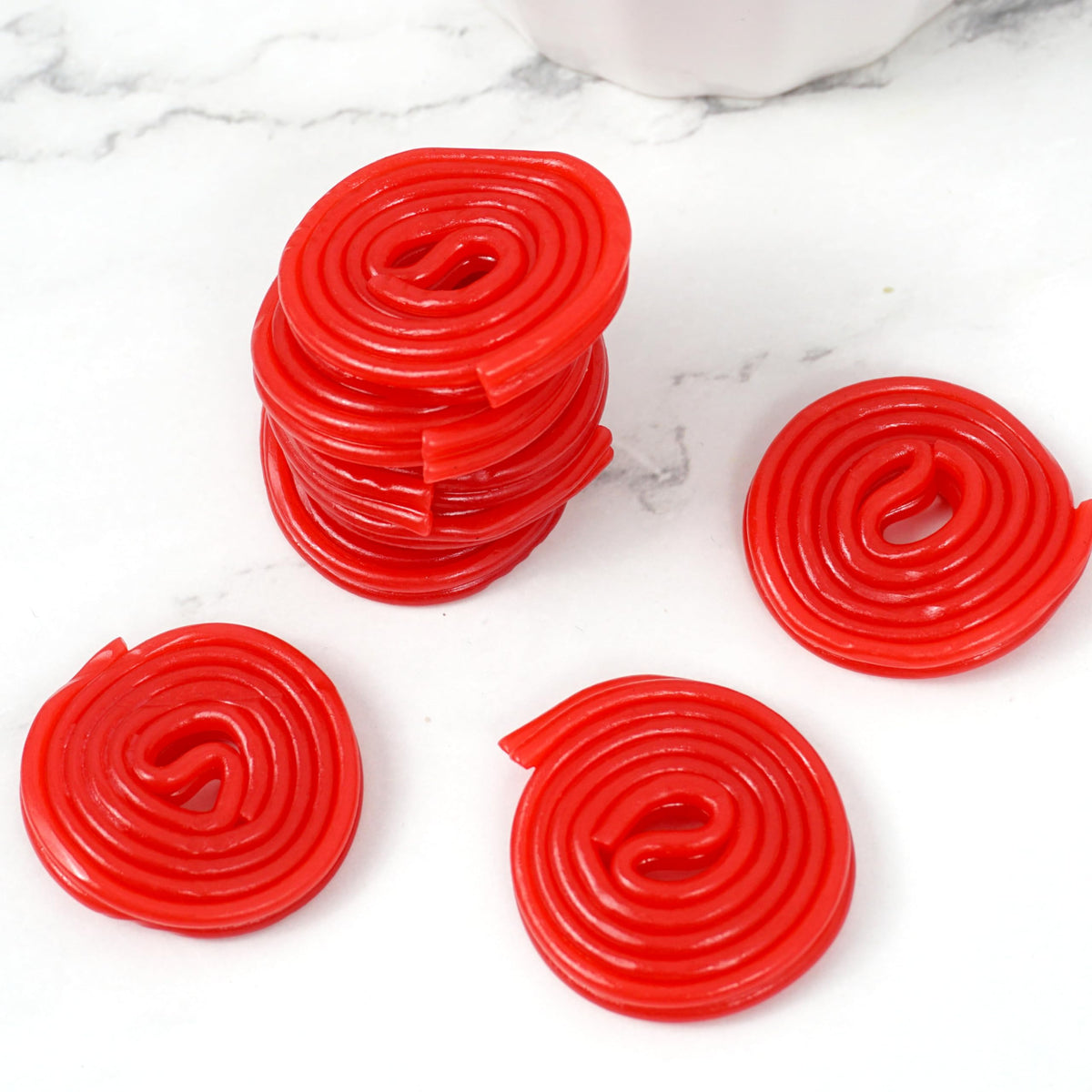 Broadway Strawberry Wheels licorice chewy wheels shown in a family-friendly party setting.