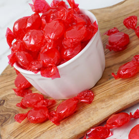 The Hampton Candy Company Arcor Cinnamon Discs served in a bowl for festive treats.
