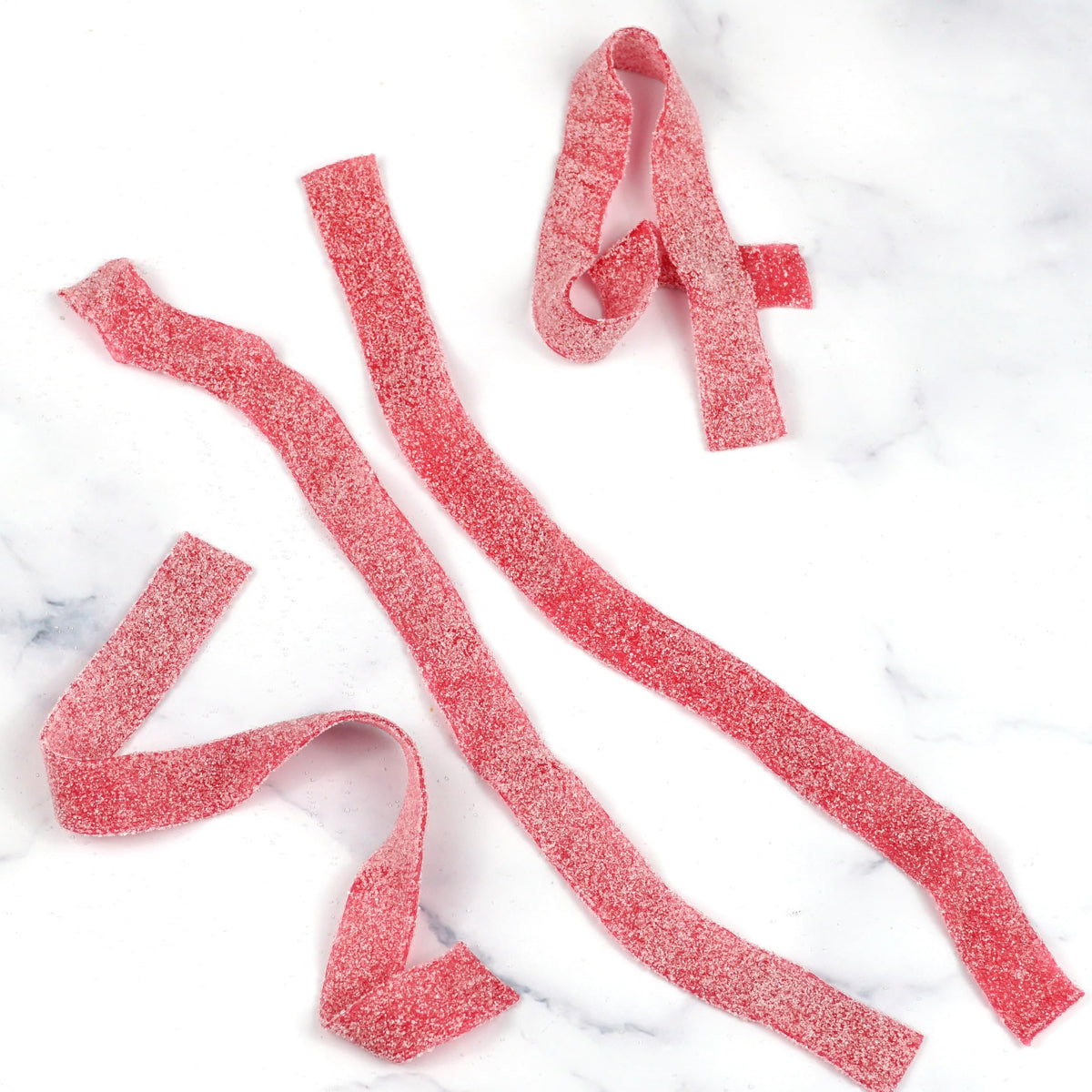 The Hampton Cherry Sour Belts colorful strips highlight premium quality ingredients.