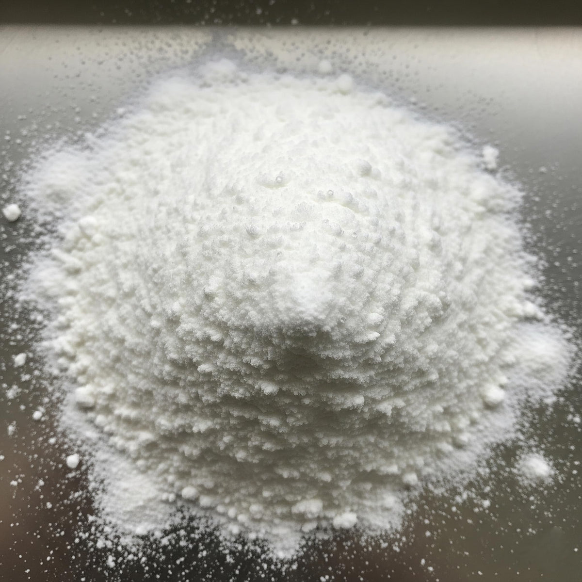 Hampton Distribution ammonium bicarbonate for bread, cookies, and crackers in a home kitchen setup.