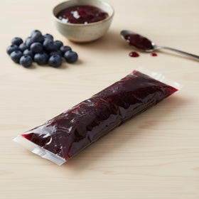 Hampton Distribution blueberry pie filling on finished dessert slice showing rich color.