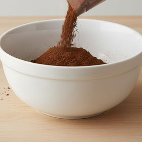 Hampton Distribution Dutch Process Cocoa Powder hot cocoa mug creates rich drinks.