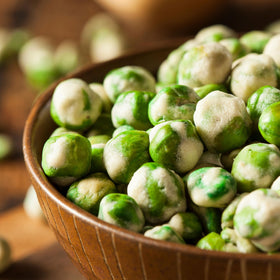 Hampton Distribution wasabi peas on snack plate—ideal movie night treat.