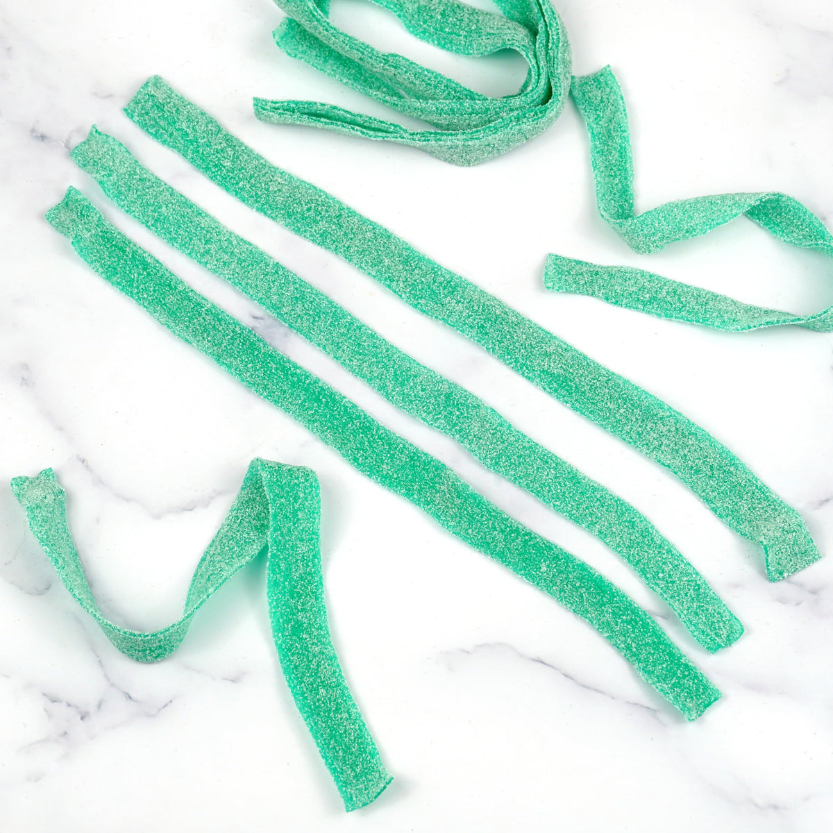 Hampton Green Apple Sour Belts served in a party plate for sharing