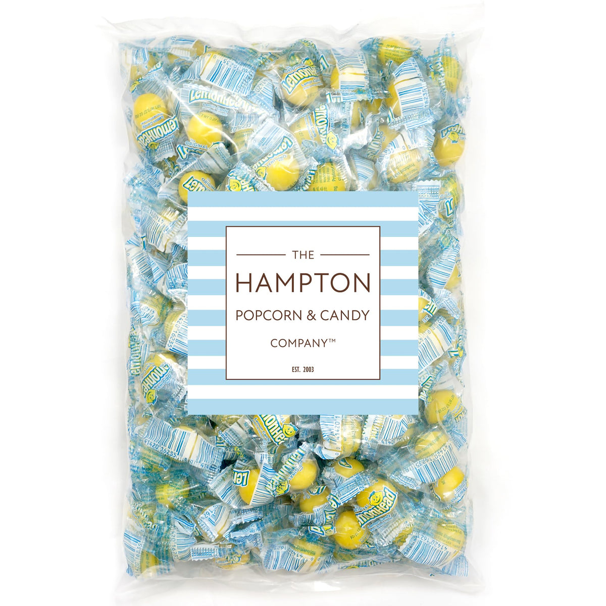 Lemonheads candy close-up highlights tart yellow sugar coating and crisp texture.