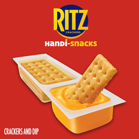 Open snack pack revealing crackers and dip, ideal for lunchbox.