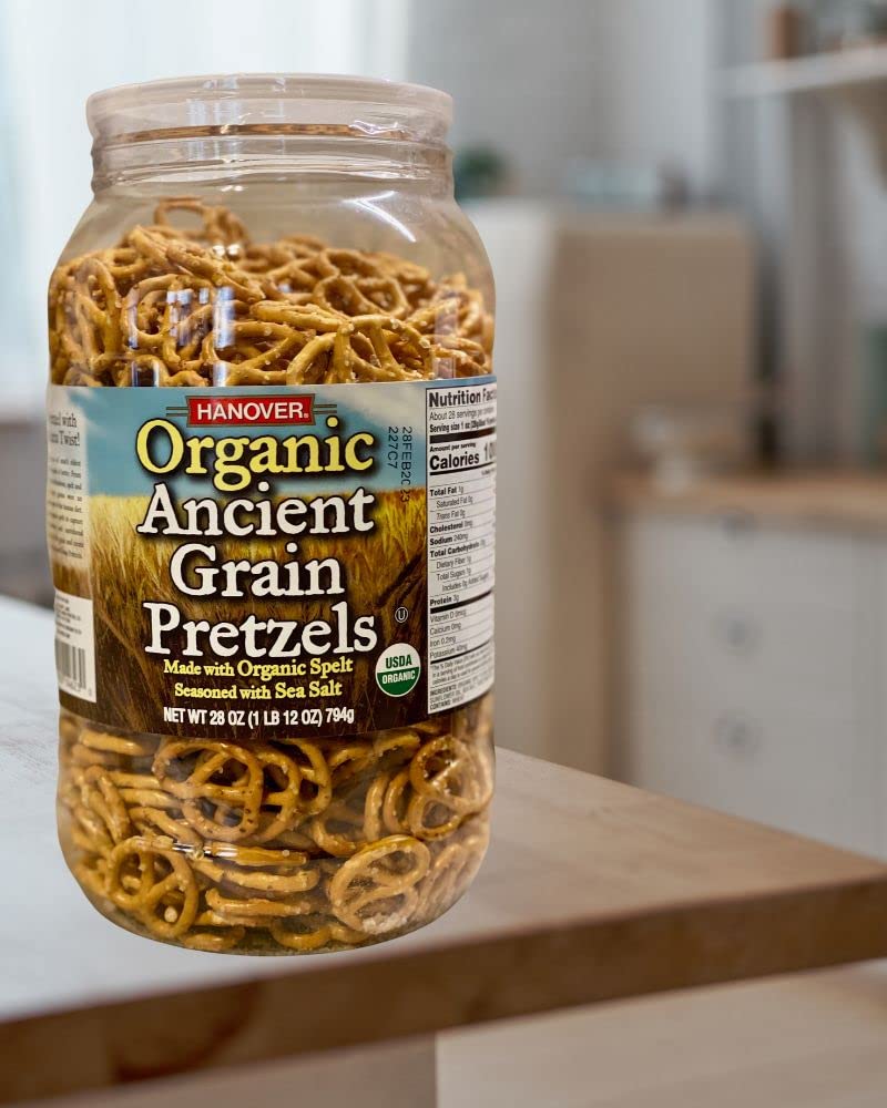 Pretzels arranged on a charcuterie board with dips and accompaniments