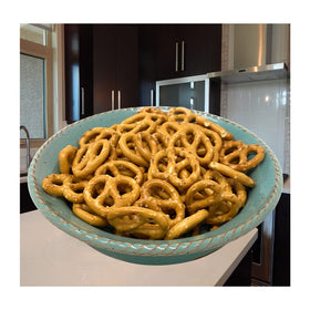 A hand holds Hanover pretzels, illustrating portable snacking