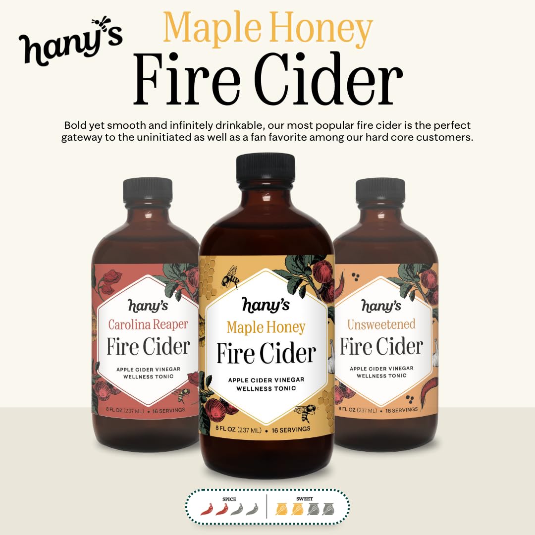 Pouring Hany's Fire Cider into tea for a zesty, warming boost.