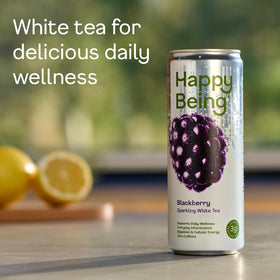 Happy Being Blackberry Sparkling White Tea pouring into a glass with fizz