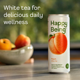 Happy Being Peach White Tea packaging highlights plant-based, low-sugar wellness.