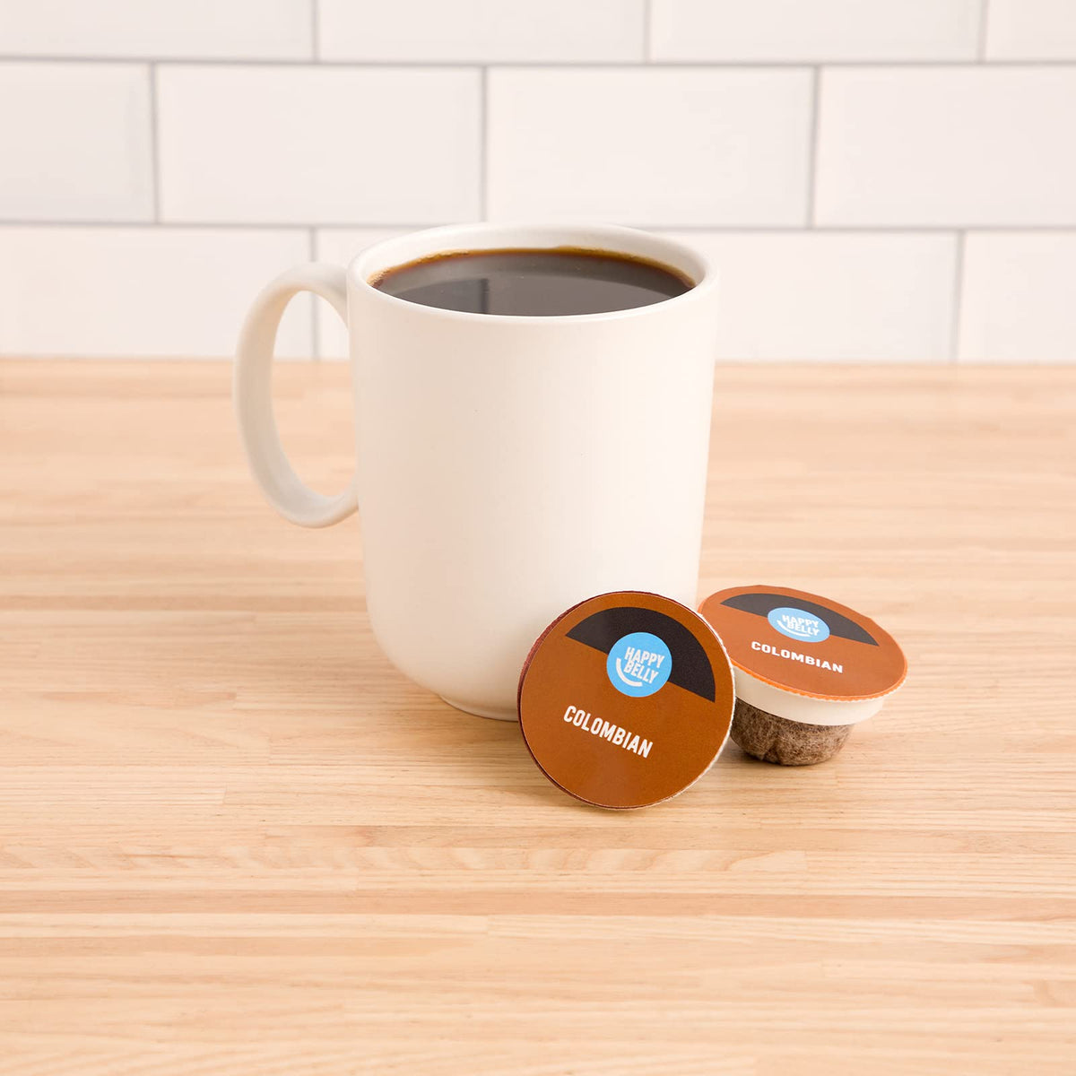 Happy Belly Colombian coffee pods close-up showing compact pod design